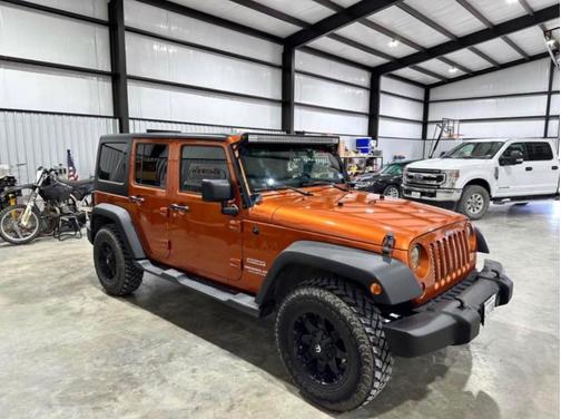 Orange 2011 Jeep Wrangler Unlimited Sport