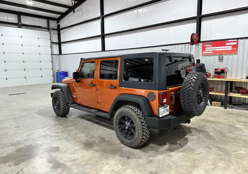 Orange 2011 Jeep Wrangler Unlimited Sport
