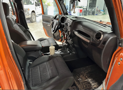 Orange 2011 Jeep Wrangler Unlimited Sport