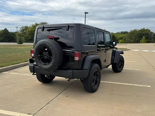 Black 2015 Jeep Wrangler Unlimited Sport