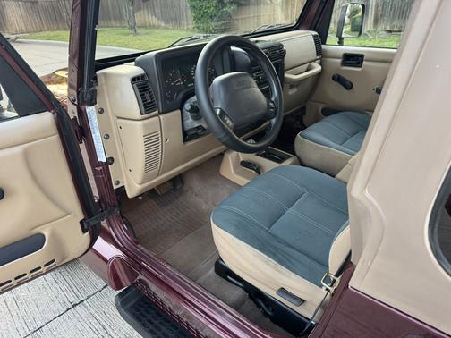 Red 2002 Jeep Wrangler Sahara