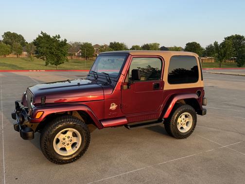 Red 2002 Jeep Wrangler Sahara