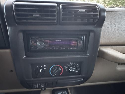 Red 2002 Jeep Wrangler Sahara