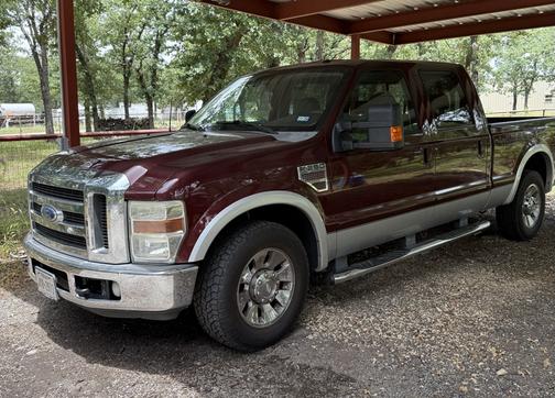 Red 2010 Ford F-250 Lariat Super Duty Crew Cab
