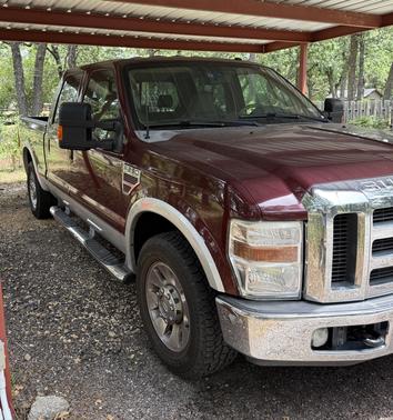 Red 2010 Ford F-250 Lariat Super Duty Crew Cab