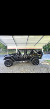 Black 2014 Jeep Wrangler Unlimited Sport