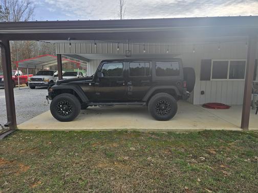 Black 2014 Jeep Wrangler Unlimited Sport