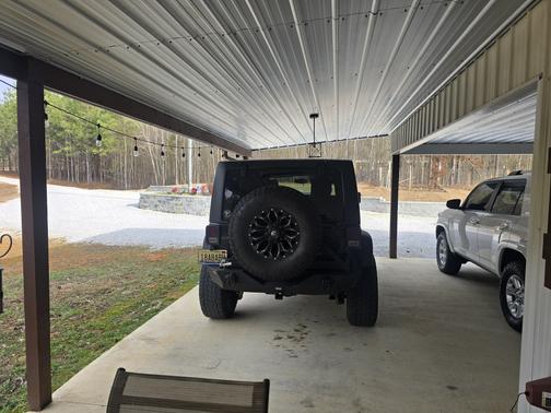 Black 2014 Jeep Wrangler Unlimited Sport