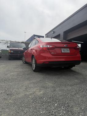 Red 2012 Ford Focus SEL