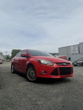 Red 2012 Ford Focus SEL