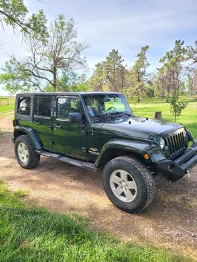 Green 2010 Jeep Wrangler Unlimited Sahara