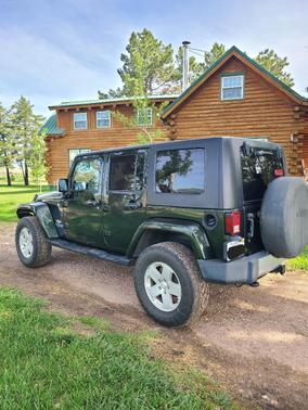 Green 2010 Jeep Wrangler Unlimited Sahara