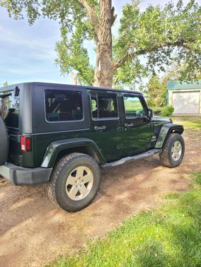 Green 2010 Jeep Wrangler Unlimited Sahara
