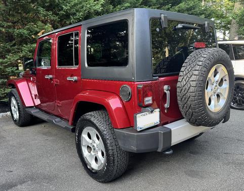 Red 2013 Jeep Wrangler Unlimited Sahara