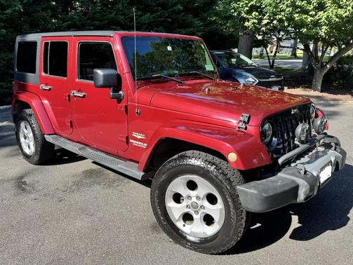 Red 2013 Jeep Wrangler Unlimited Sahara