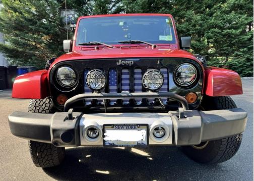 Red 2013 Jeep Wrangler Unlimited Sahara