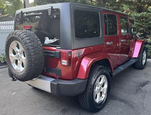 Red 2013 Jeep Wrangler Unlimited Sahara