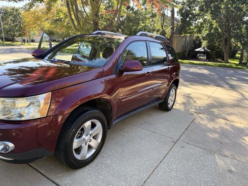 Red 2008 Pontiac Torrent Base