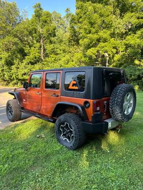 Orange 2010 Jeep Wrangler Unlimited Sahara