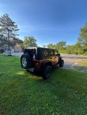 Orange 2010 Jeep Wrangler Unlimited Sahara