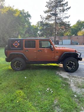Orange 2010 Jeep Wrangler Unlimited Sahara