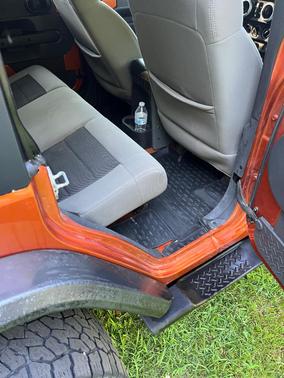 Orange 2010 Jeep Wrangler Unlimited Sahara