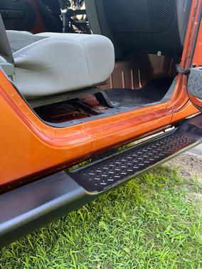 Orange 2010 Jeep Wrangler Unlimited Sahara