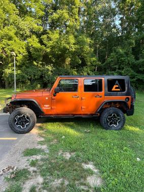 Orange 2010 Jeep Wrangler Unlimited Sahara