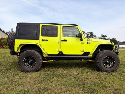 Green 2016 Jeep Wrangler Unlimited Sport