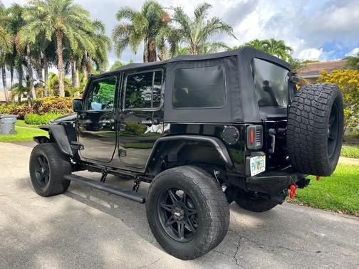 Black 2014 Jeep Wrangler Unlimited Sport
