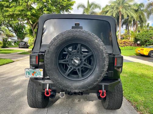 Black 2014 Jeep Wrangler Unlimited Sport