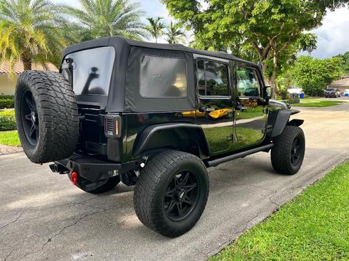 Black 2014 Jeep Wrangler Unlimited Sport