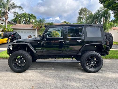 Black 2014 Jeep Wrangler Unlimited Sport