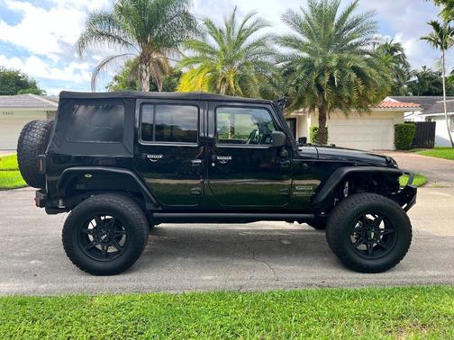 Black 2014 Jeep Wrangler Unlimited Sport