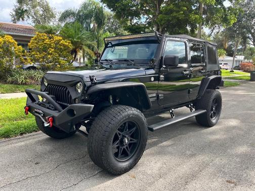 Black 2014 Jeep Wrangler Unlimited Sport