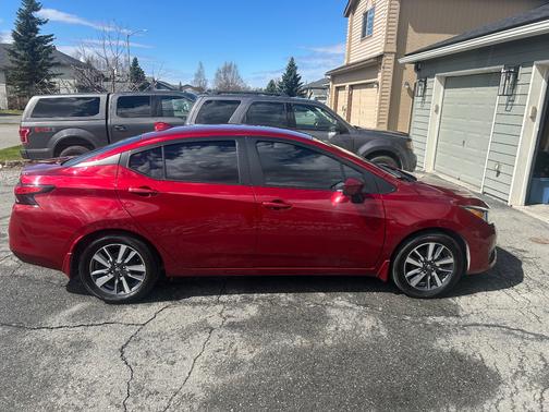 Red 2024 Nissan Versa SV