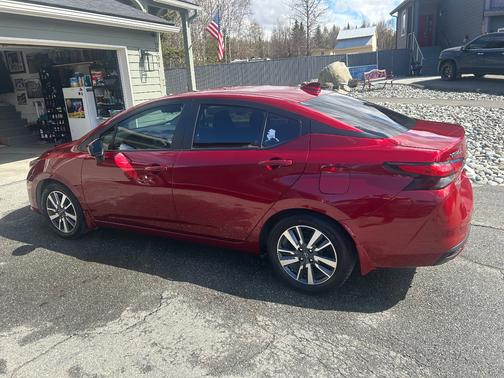 Red 2024 Nissan Versa SV