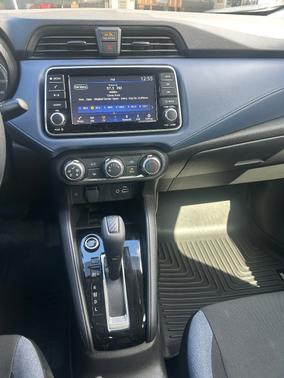 Red 2024 Nissan Versa SV
