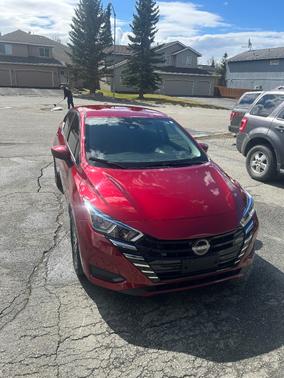 Red 2024 Nissan Versa SV