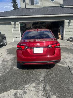 Red 2024 Nissan Versa SV