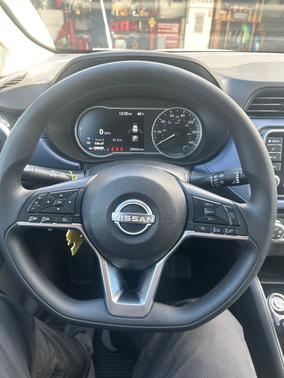 Red 2024 Nissan Versa SV