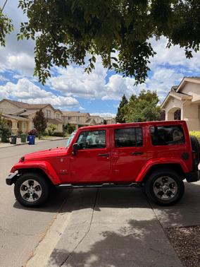 Red 2016 Jeep Wrangler Unlimited Sahara