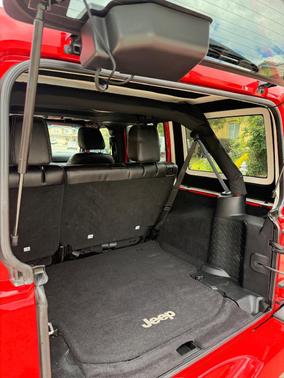 Red 2016 Jeep Wrangler Unlimited Sahara