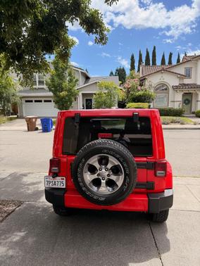 Red 2016 Jeep Wrangler Unlimited Sahara