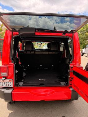 Red 2016 Jeep Wrangler Unlimited Sahara