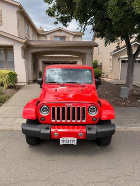 Red 2016 Jeep Wrangler Unlimited Sahara