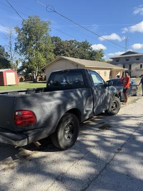 Black 2000 Ford F-150 XLT Flareside