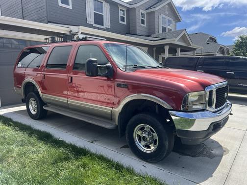 Red 2001 Ford Excursion Limited