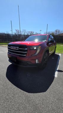 Red 2024 GMC Acadia Elevation