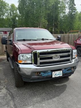 Red 2004 Ford F-250 Lariat Crew Cab Super Duty